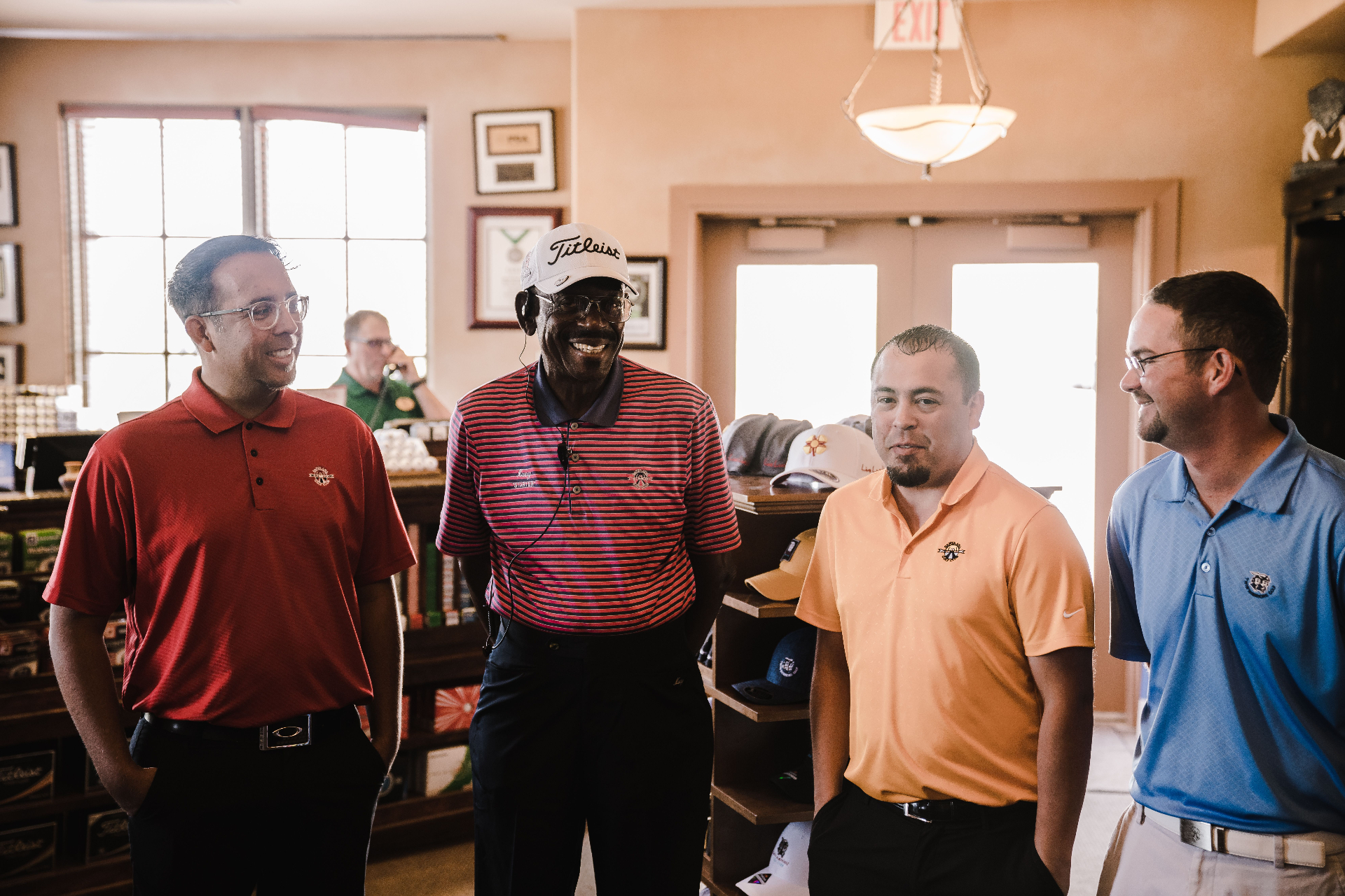 Group of golfers and event staff together in the pro shop